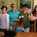 Six JUFJ Campaign Fund women at a phone bank.