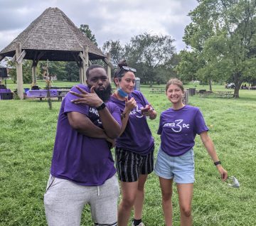 Under 3 DC organizers pose in a park